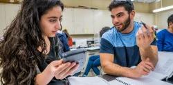 two students making calculations on lab test data